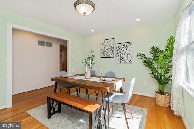 dining space with visible vents, recessed lighting, baseboards, and light wood-style floors