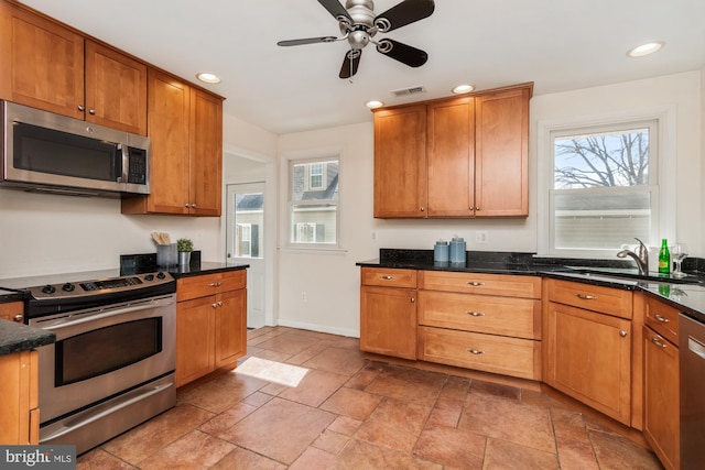 kitchen featuring recessed lighting, a healthy amount of sunlight, appliances with stainless steel finishes, and a sink