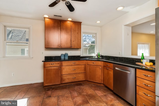 kitchen featuring visible vents, baseboards, recessed lighting, brown cabinetry, and stainless steel dishwasher