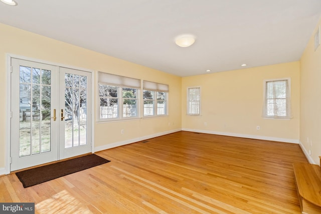 doorway to outside with recessed lighting, french doors, baseboards, and light wood finished floors