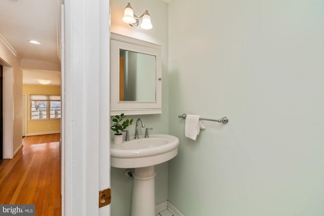 bathroom featuring baseboards and wood finished floors