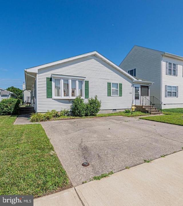 back of property featuring a porch and a lawn