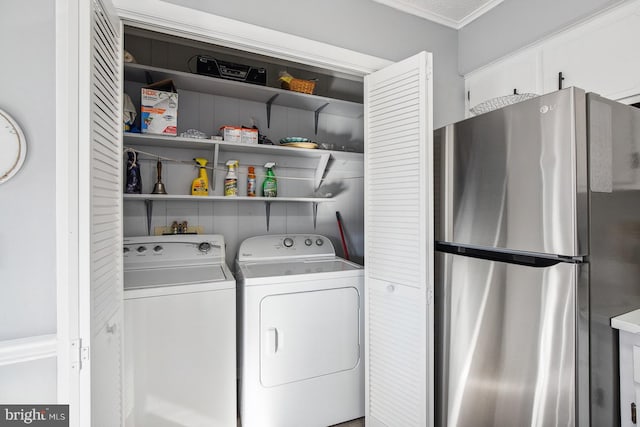 laundry area with washing machine and dryer