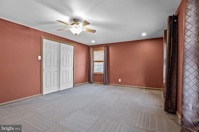 unfurnished bedroom with a closet and ceiling fan