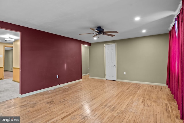 unfurnished room with ceiling fan and light hardwood / wood-style floors