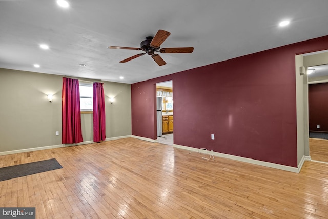 unfurnished room with light hardwood / wood-style floors and ceiling fan