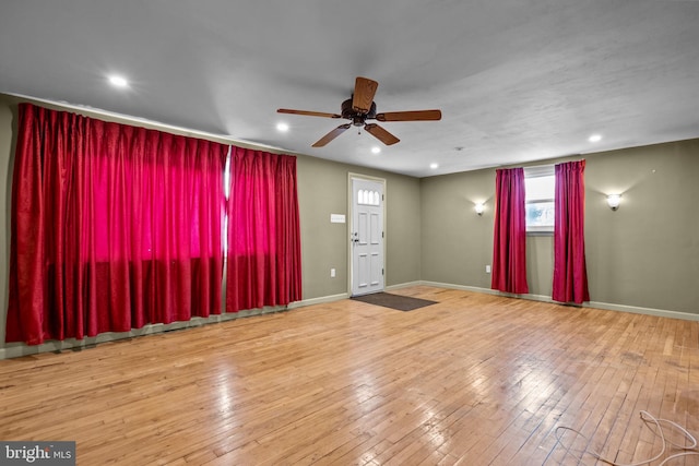 unfurnished room with ceiling fan and hardwood / wood-style floors