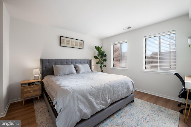 bedroom with hardwood / wood-style floors