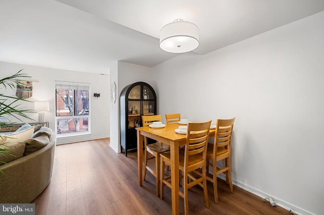 dining area with wood-type flooring