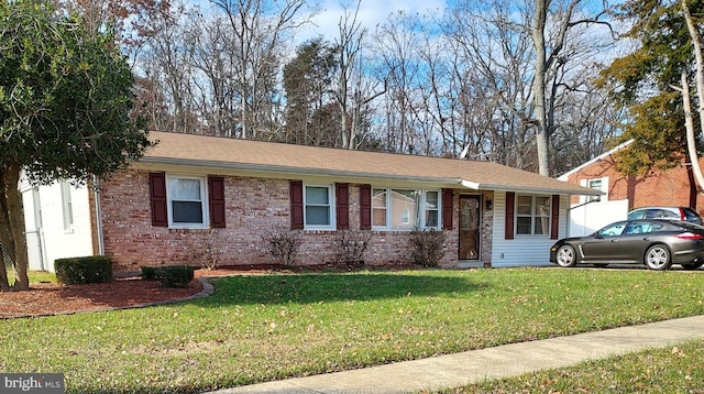 single story home featuring a front lawn