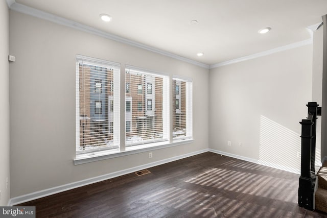 interior space featuring ornamental molding and dark hardwood / wood-style floors