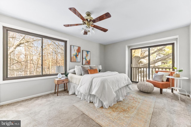 bedroom with access to exterior, light colored carpet, and ceiling fan