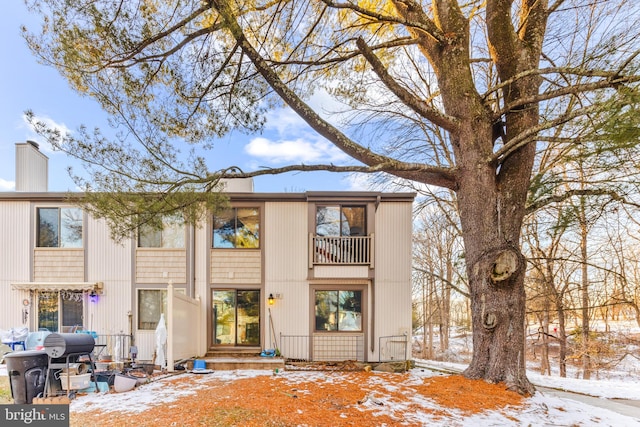 view of snow covered house