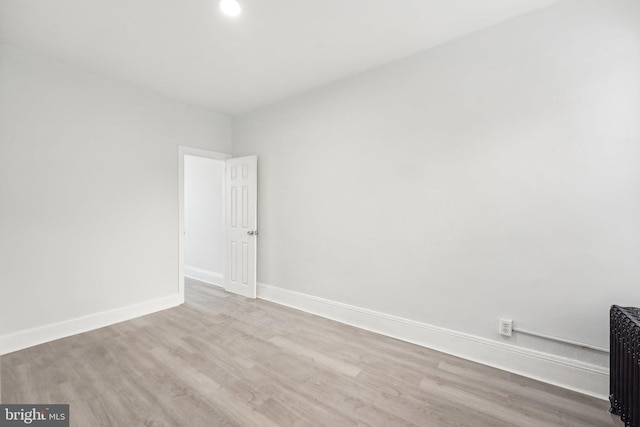 spare room with light wood-type flooring