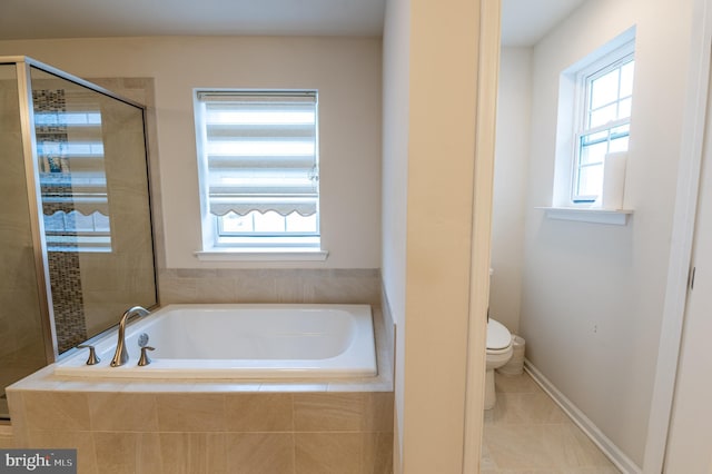 bathroom with toilet, tile patterned flooring, and plus walk in shower