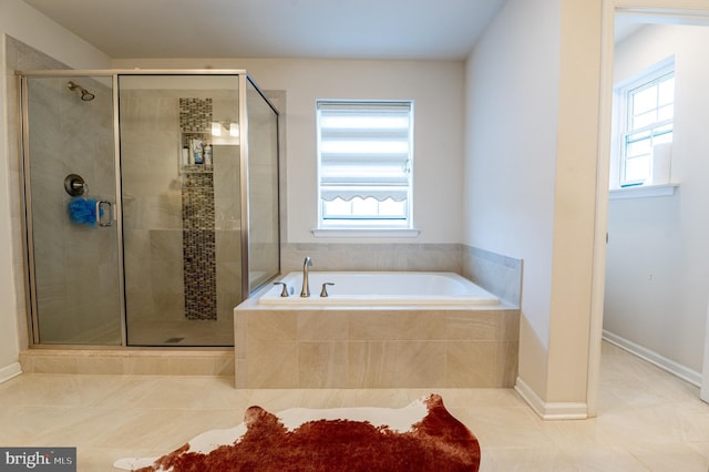 bathroom with tile patterned floors and plus walk in shower