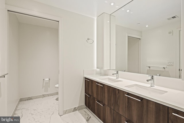 bathroom with vanity and toilet