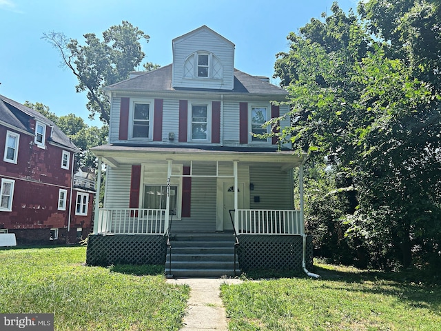 view of front of property featuring a porch and a front yard