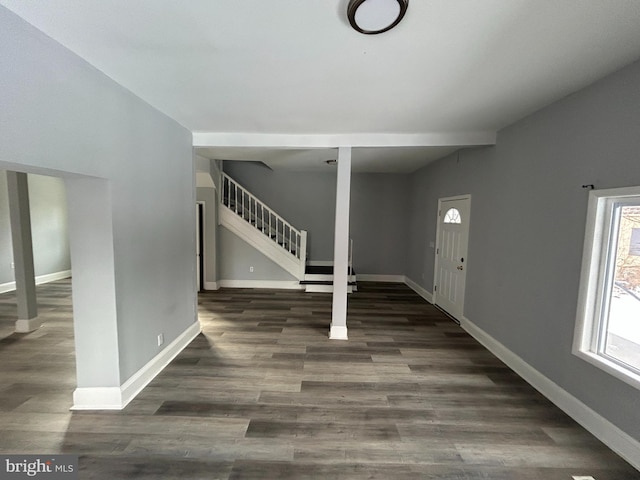 foyer entrance featuring dark hardwood / wood-style floors