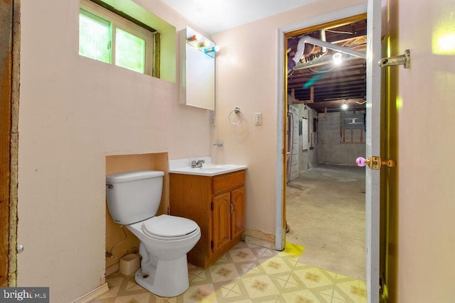 bathroom featuring toilet and vanity