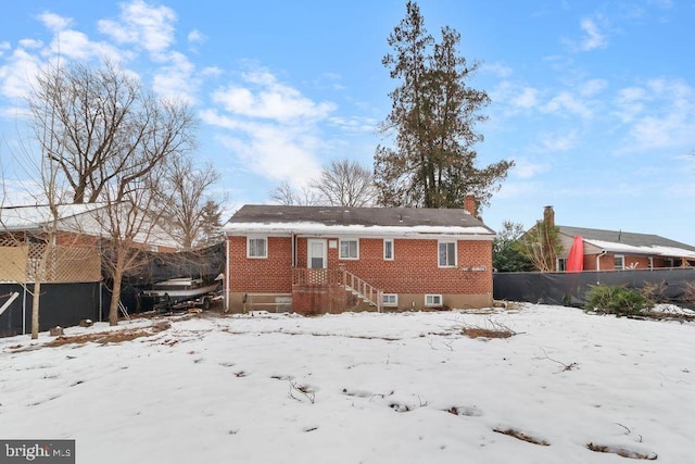 view of snow covered house