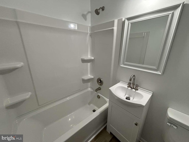 full bathroom with washtub / shower combination, toilet, and vanity