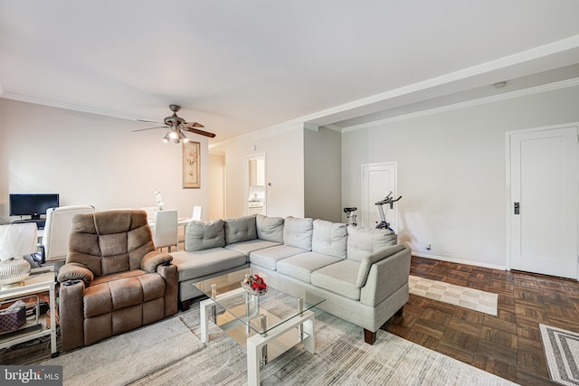 living room with ceiling fan, dark parquet floors, and ornamental molding