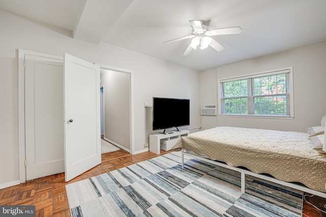 bedroom featuring ceiling fan and parquet flooring