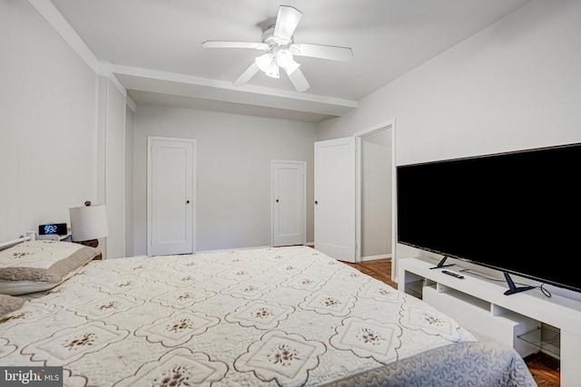 bedroom with ceiling fan and hardwood / wood-style flooring