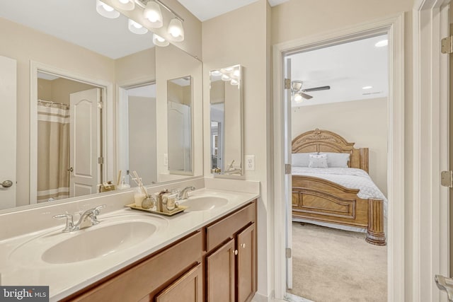 bathroom with ceiling fan and vanity