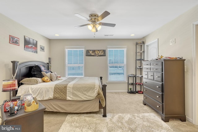 carpeted bedroom featuring ceiling fan