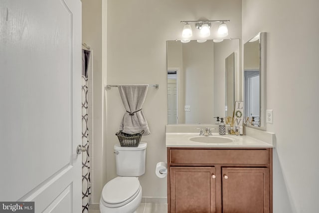 bathroom featuring vanity, tile patterned flooring, toilet, and a shower with shower curtain