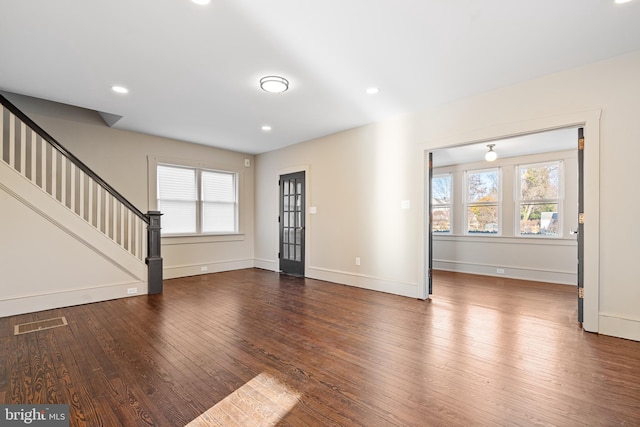 unfurnished living room featuring hardwood / wood-style floors