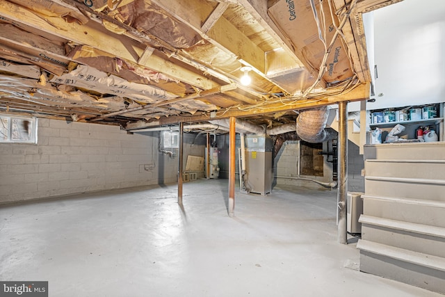 basement featuring heating unit and gas water heater