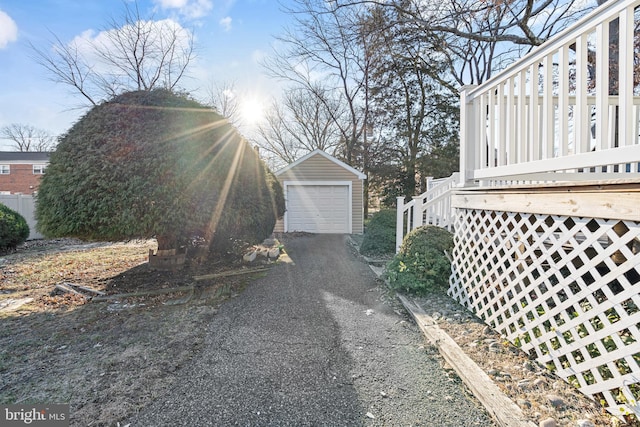 view of property exterior with an outbuilding and a garage