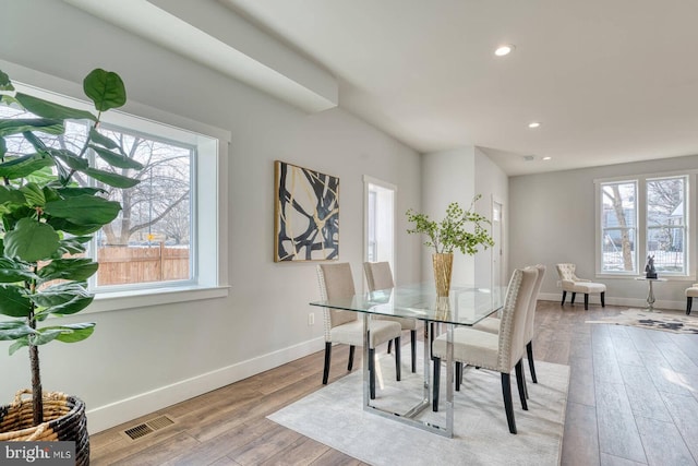 dining space with light hardwood / wood-style flooring