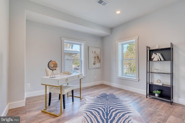 office space with hardwood / wood-style flooring