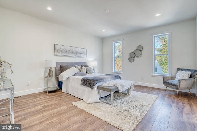 bedroom with light wood-type flooring