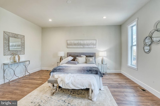 bedroom featuring hardwood / wood-style floors