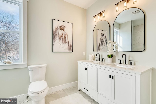 bathroom with vanity and toilet