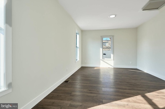 spare room featuring dark hardwood / wood-style flooring