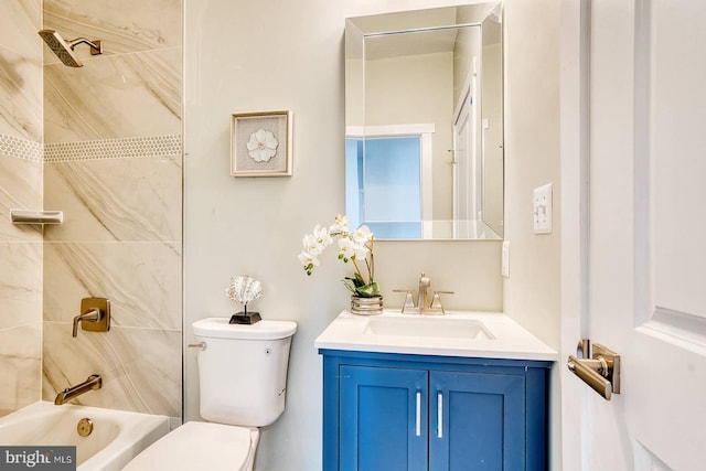 full bathroom with vanity, toilet, and tiled shower / bath combo