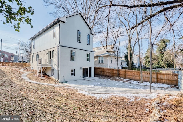 rear view of property featuring a patio