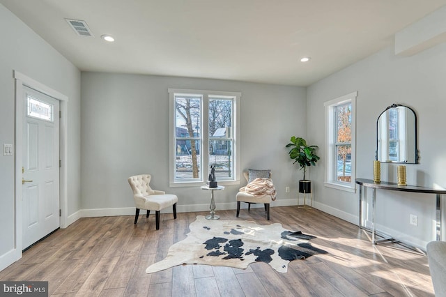 sitting room featuring light hardwood / wood-style floors