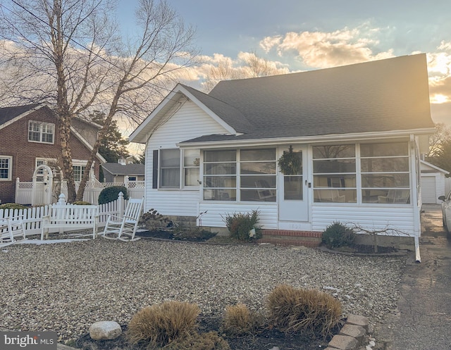 view of front of home with a sunroom