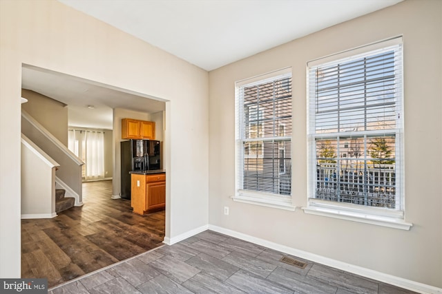 empty room featuring dark hardwood / wood-style flooring