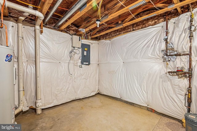 basement featuring electric panel and water heater