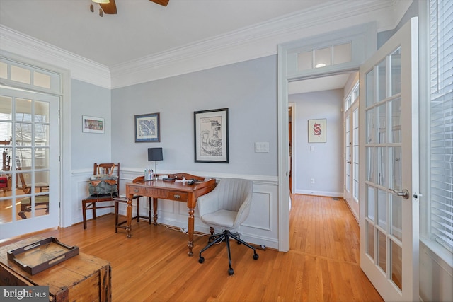 office with ornamental molding, ceiling fan, light wood-type flooring, and french doors