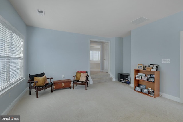 sitting room with light colored carpet