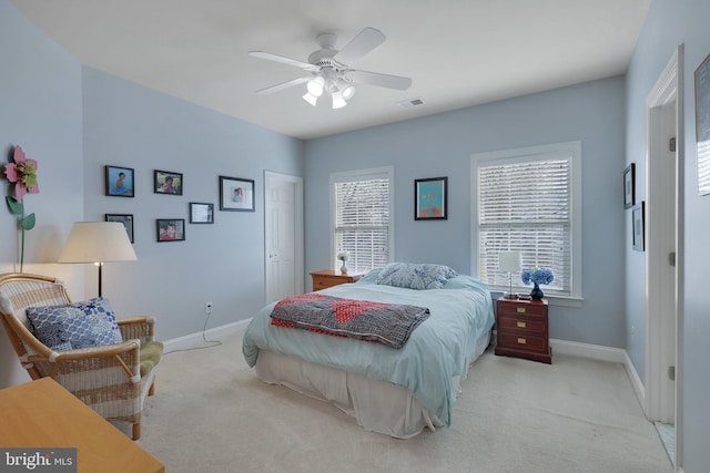 carpeted bedroom featuring ceiling fan